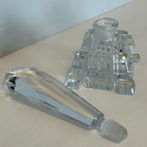 1930s vintage luxury perfume bottle square base and elongated stopper.